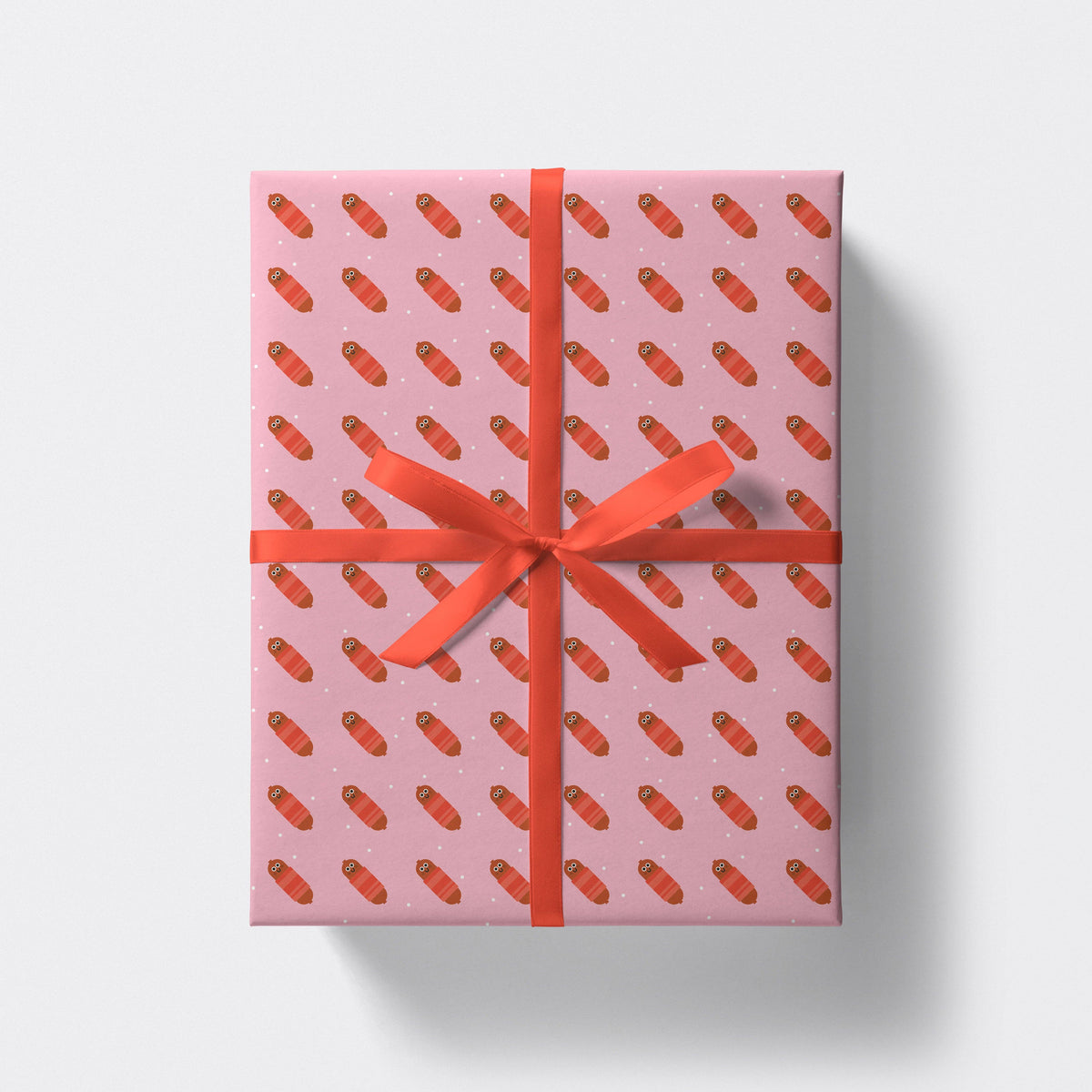 Pigs in Blankets Christmas Wrapping Paper Sheet as a wrapped gift by penny black