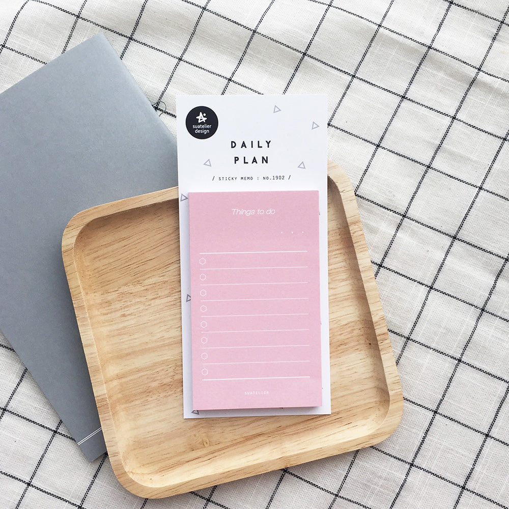 Suatelier No 1902 Daily Plan.02 Sticky Notepad by penny black on a tabletop