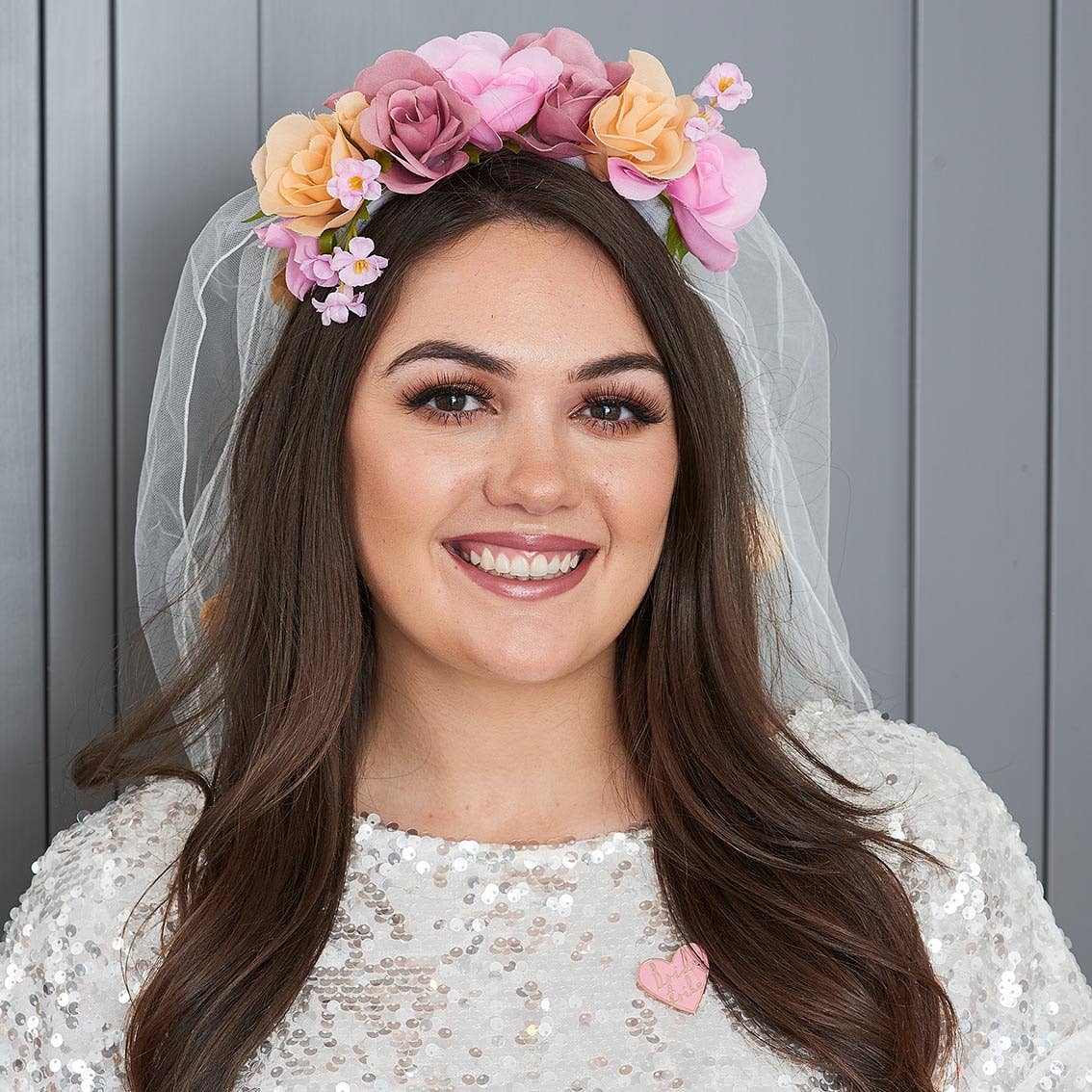 Luxe Floral Wedding Veil Hen Party Accessory being shown on a person's head