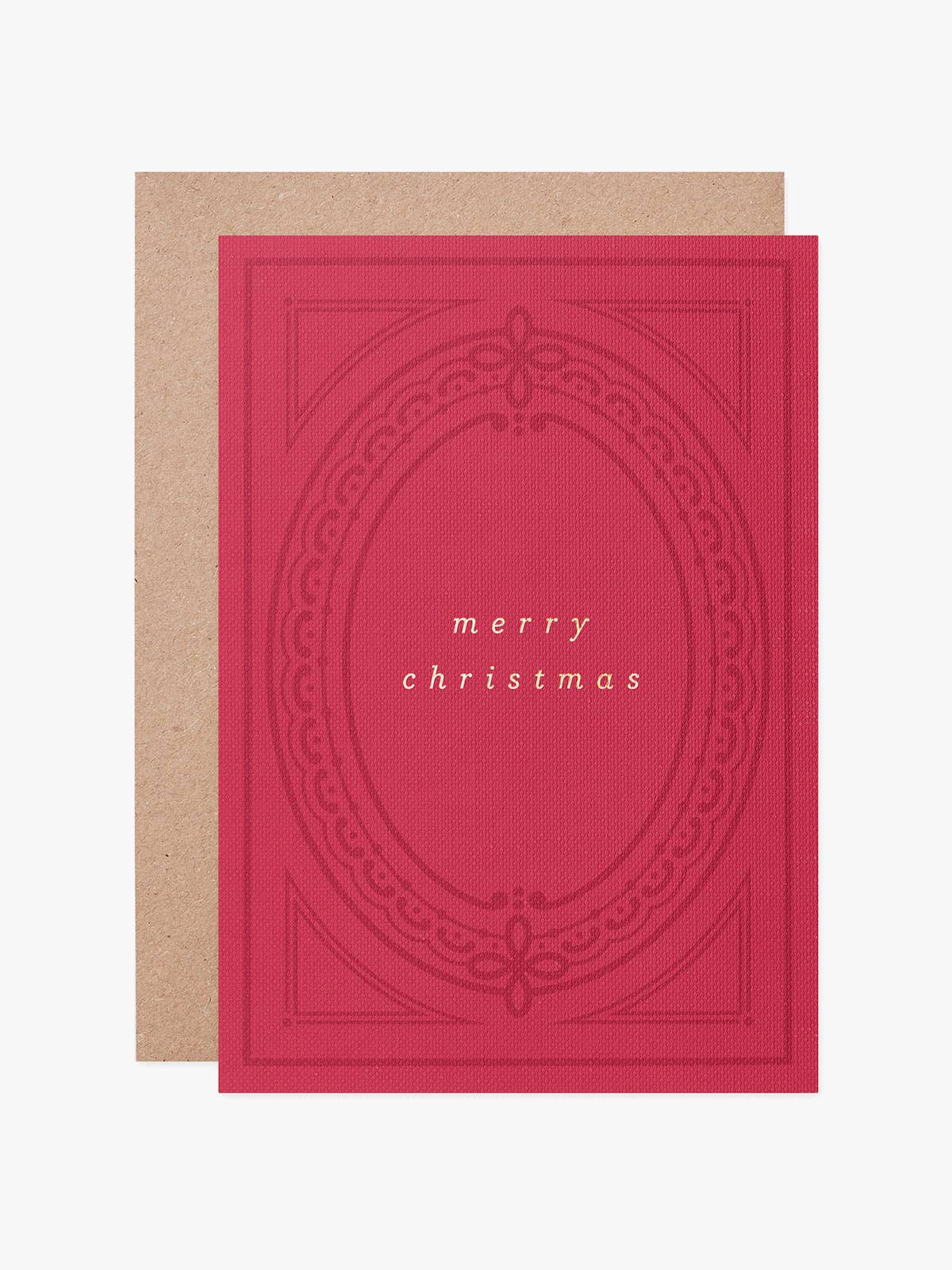 A red Christmas greeting card with an embossed oval design and the words 'merry christmas' in small gold text, shown with a kraft paper envelope on a light gray background.
