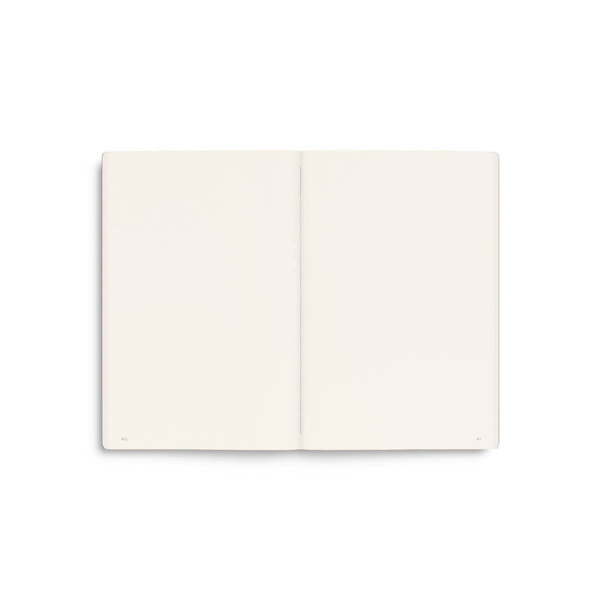 An open two-page plain A5 notebook with blank, dotted cream-coloured pages, shown from a top-down perspective on a clean white background.