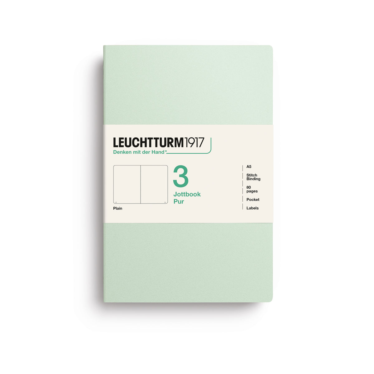 A Leuchtturm1917 3 pack of A5 notebooks with mint green cover and plain pages, shown with a bellyband with product details, on a clean white background.
