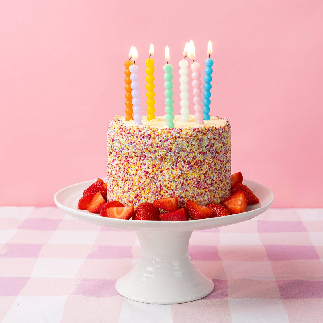 Colourful Bobble Birthday Candles 8 Pack shown on top of a cake