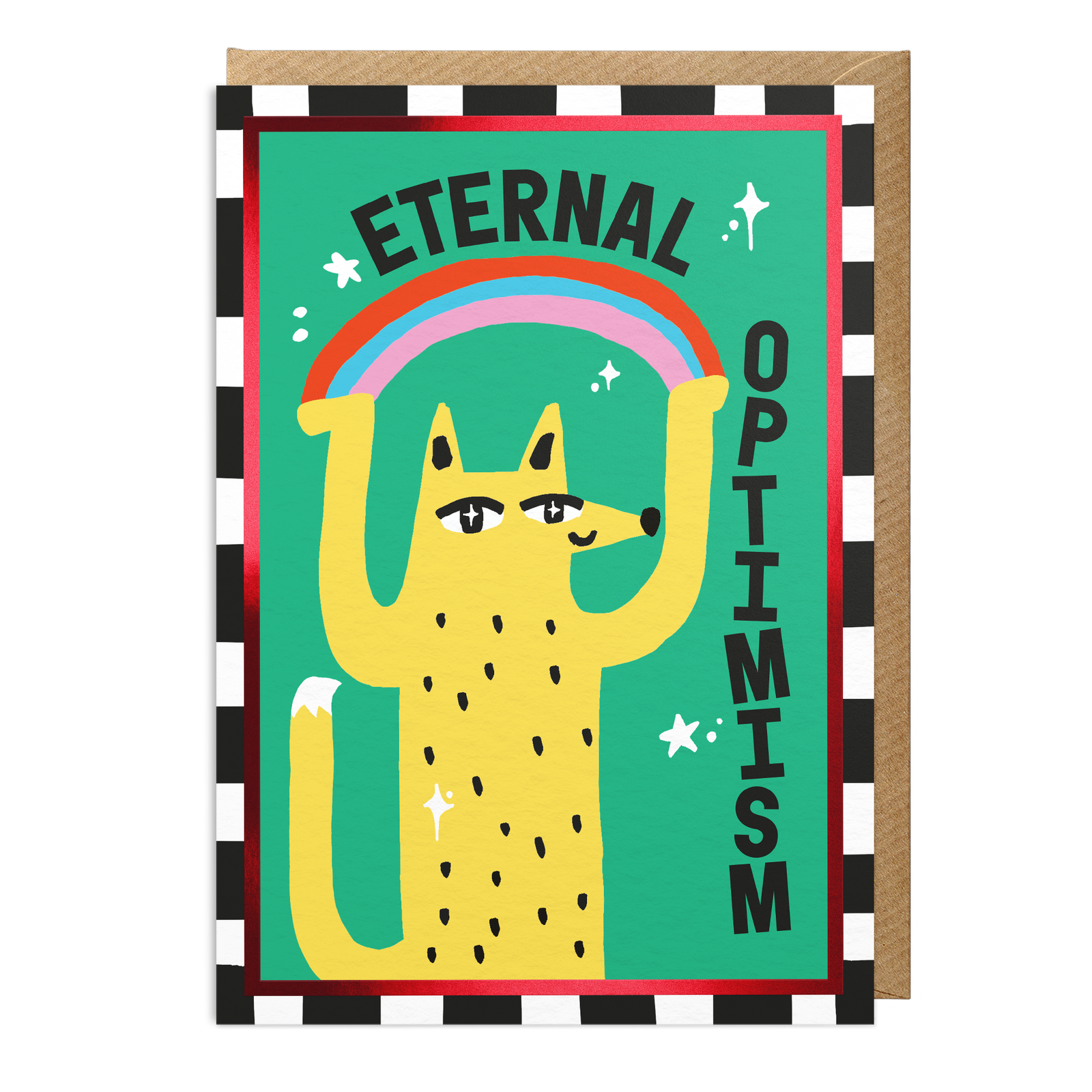 An A6 card with a colourful illustration of a yellow fox holding up a rainbow above its head, with the words 'ETERNAL OPTIMISM' written on a green background. The card is shown with a brown envelope behind it on a white background.