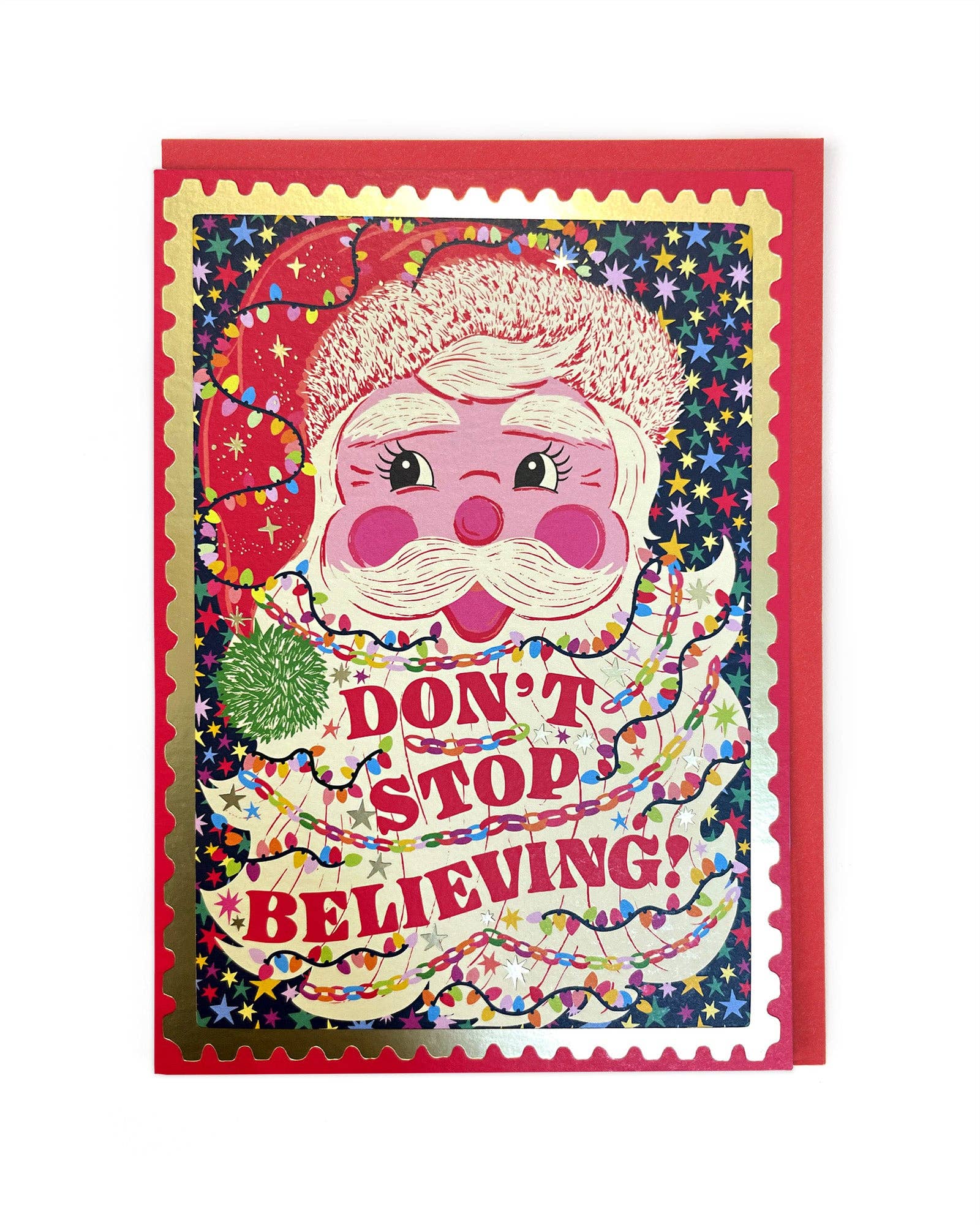 Christmas Card with a colourful design of Santa Claus and text 'Don't Stop Believing' with a red envelope.