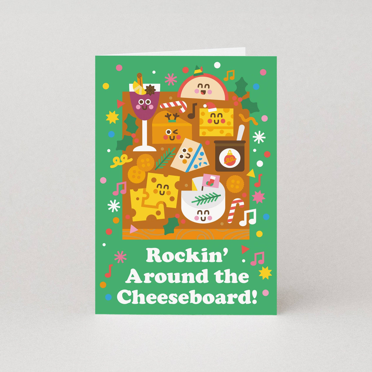 Card with festive cheeseboard design and text 'Rockin' Around the Cheeseboard!' on a green background.