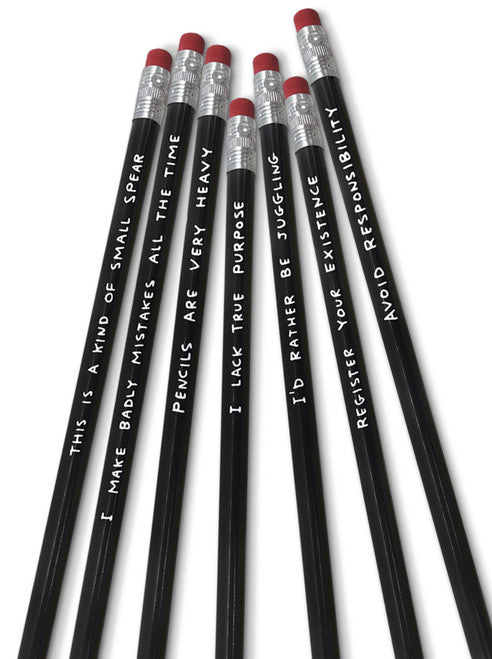 An image of 7 funny pencils by artist David Shrigley. Each black pencil has white writing with a funny phrase on it e.g. "this ia a kind of small spear". Each pencil has a rubber at the end.