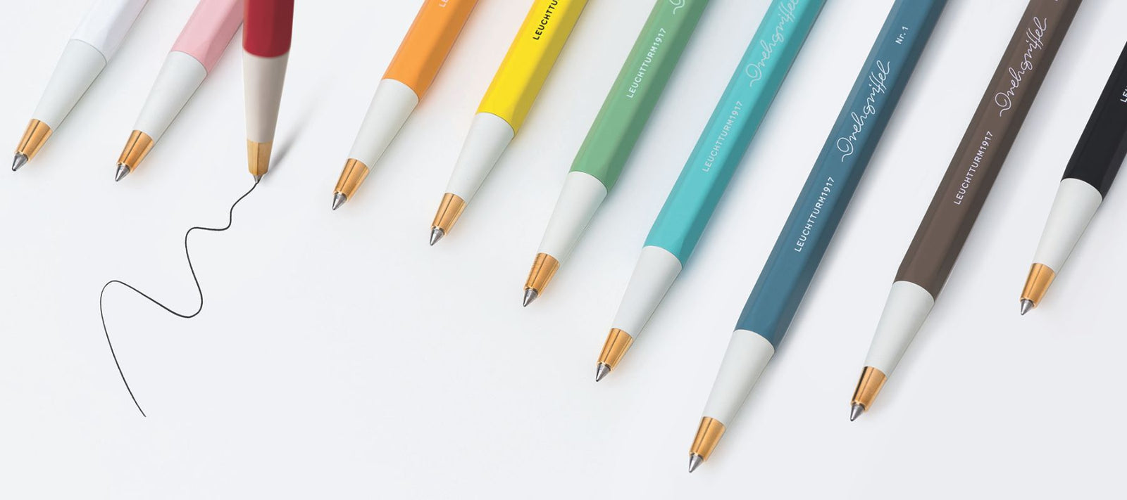 Colourful pens arranged on a white background. Drehgriffel Nr. 1 Gel Ink Ballpoint Pens at Penny Black