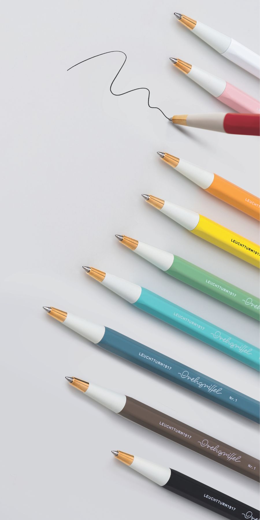Colourful pens arranged on a white background. Drehgriffel Nr. 1 Gel Ink Ballpoint Pens at Penny Black