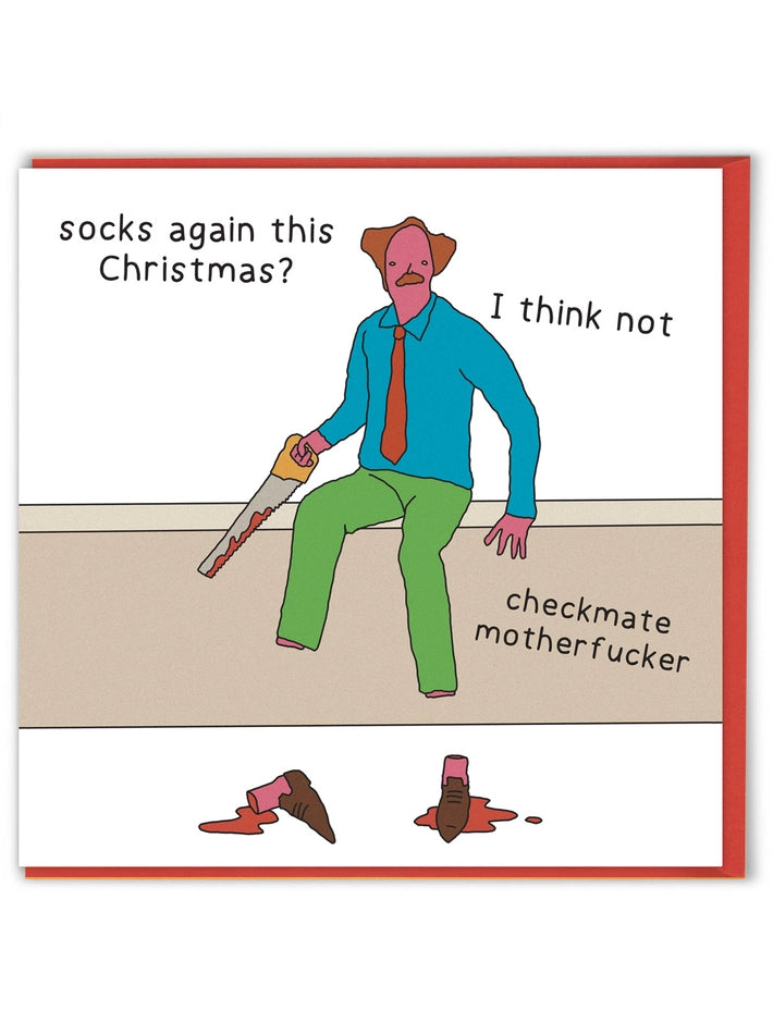 A square greeting card with a white background and red border, featuring a cartoon man in a blue shirt and green trousers sitting on a beige floor and holding a saw, with text reading 'socks again this Christmas?', 'I think not', and 'checkmate motherfucker'. Two bloody shoeprints are visible on the floor below.