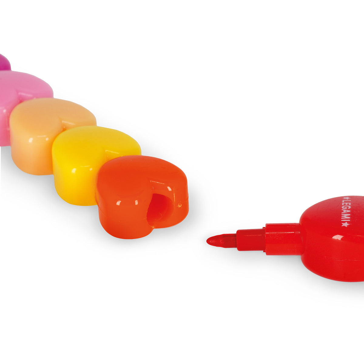 Rainbow Stacked Hearts Crayon by penny black showing tip of a red heart crayon