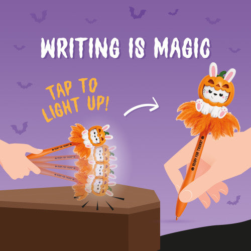 A promotional graphic for a Halloween-themed writing pen. The pen has an orange pumpkin jack-o'-lantern face with white bunny ears and a fluffy orange faux fur collar.