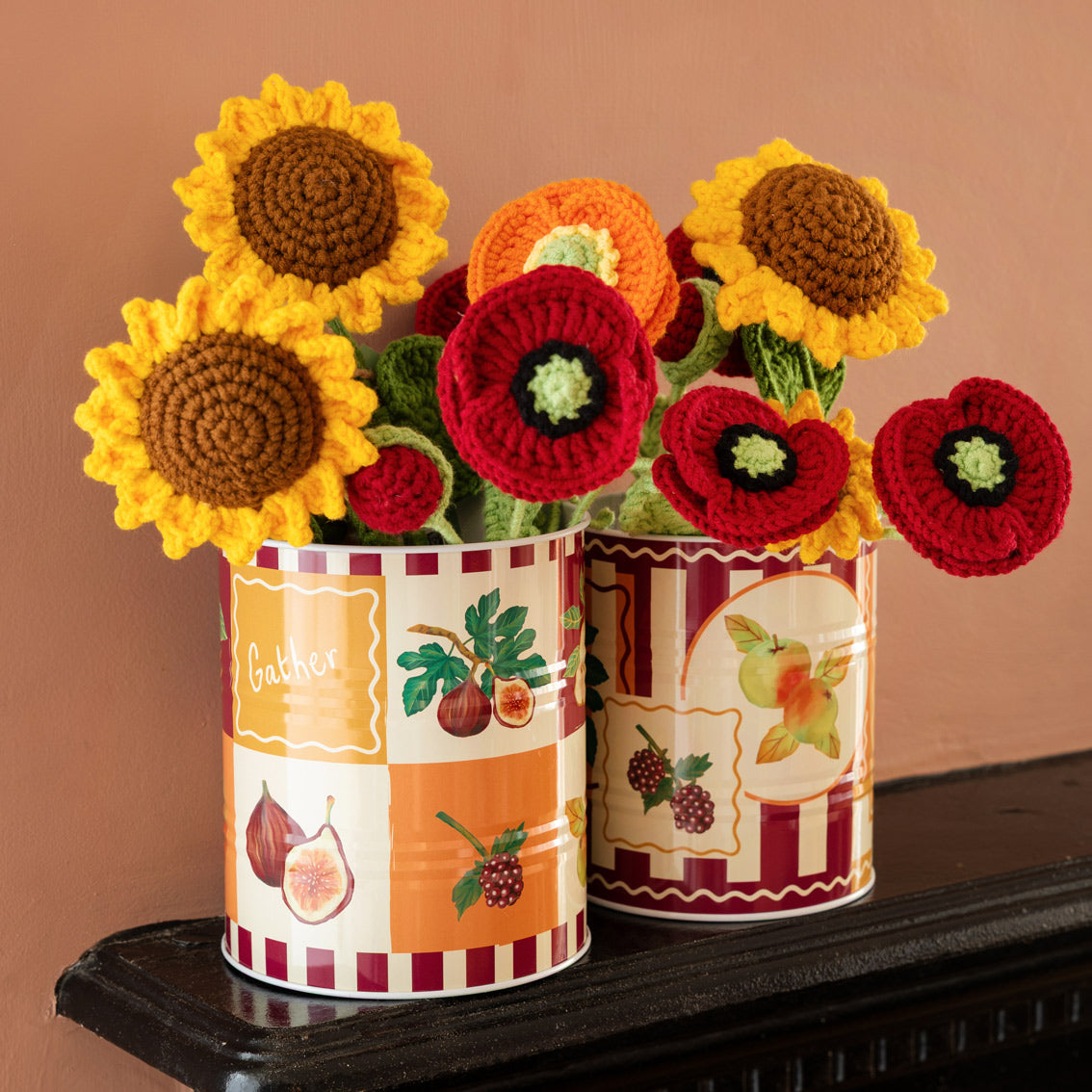 Crocheted sunflowers, poppies and anemones on a mantlepiece by talking tables at penny black