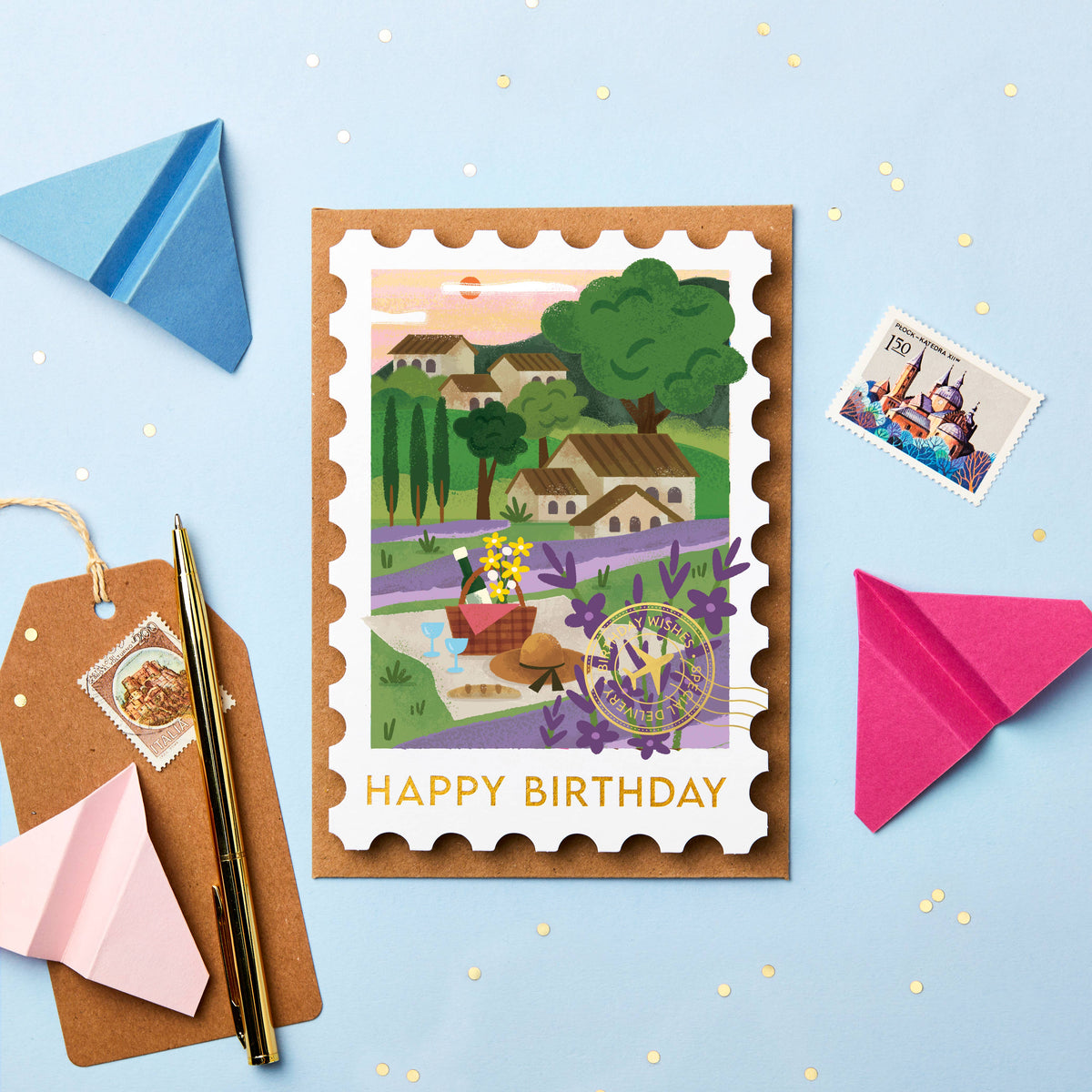 Birthday card with postage stamp design with an illustration of provence in france on a blue background with stamps and paper planes.