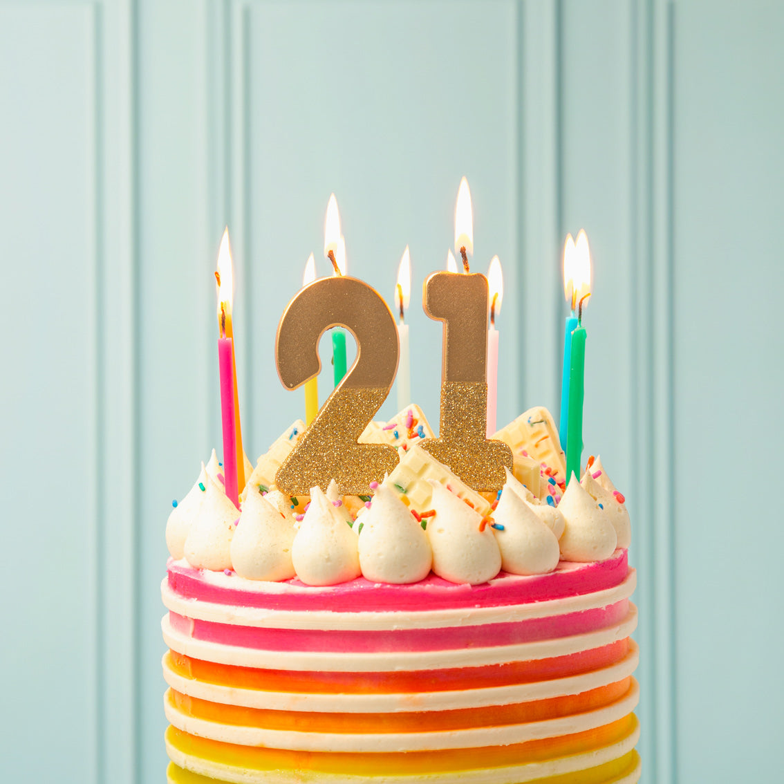 21 Gold Glitter Number Candles on top of a cake - Penny Black