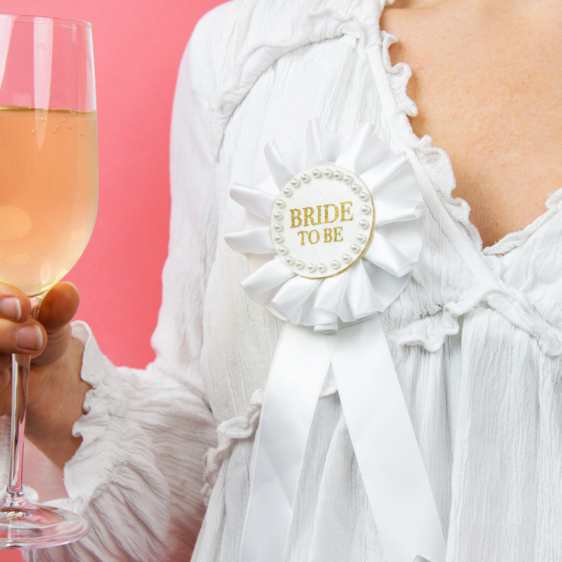 Bride To Be Pearl Rosette on a person's lapel