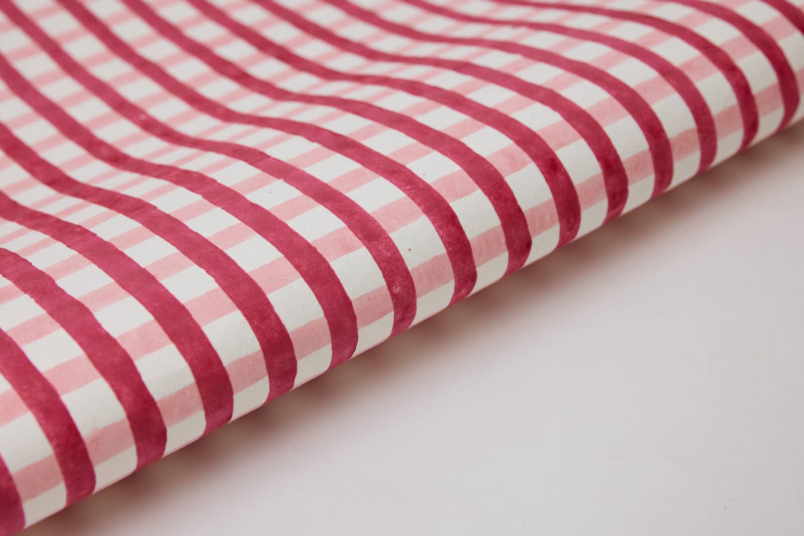 Block Printed Pink Plaid Christmas Wrapping Paper Sheet by paper mirchi at penny black - shown rolled