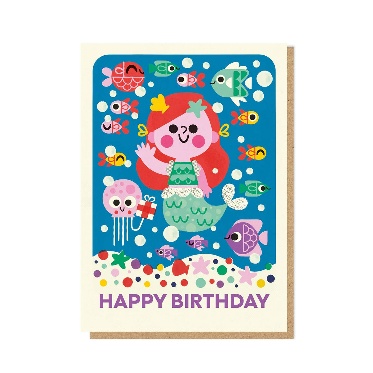 Birthday card with a mermaid illustration and colourful sea creatures on a blue background accompanied by a kraft brown envelope.