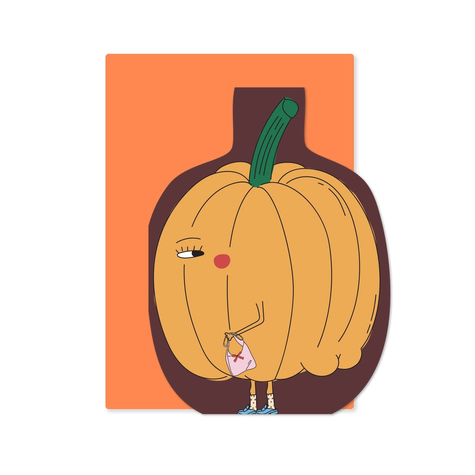 A die-cut pumpkin illustration card featuring a cute cartoon pumpkin character with a green stem, pink nose, and tiny legs holding a pink bag, set against an orange envelope with a dark brown outline.