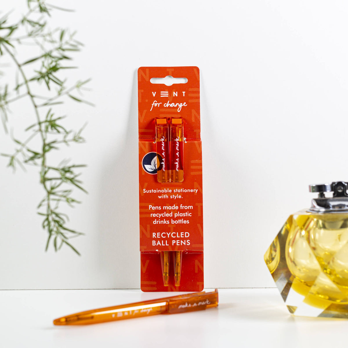Make a Mark Recycled Pen 2 pack set by Vent for Change in it's packaging against a wall in colourway burnt orange
