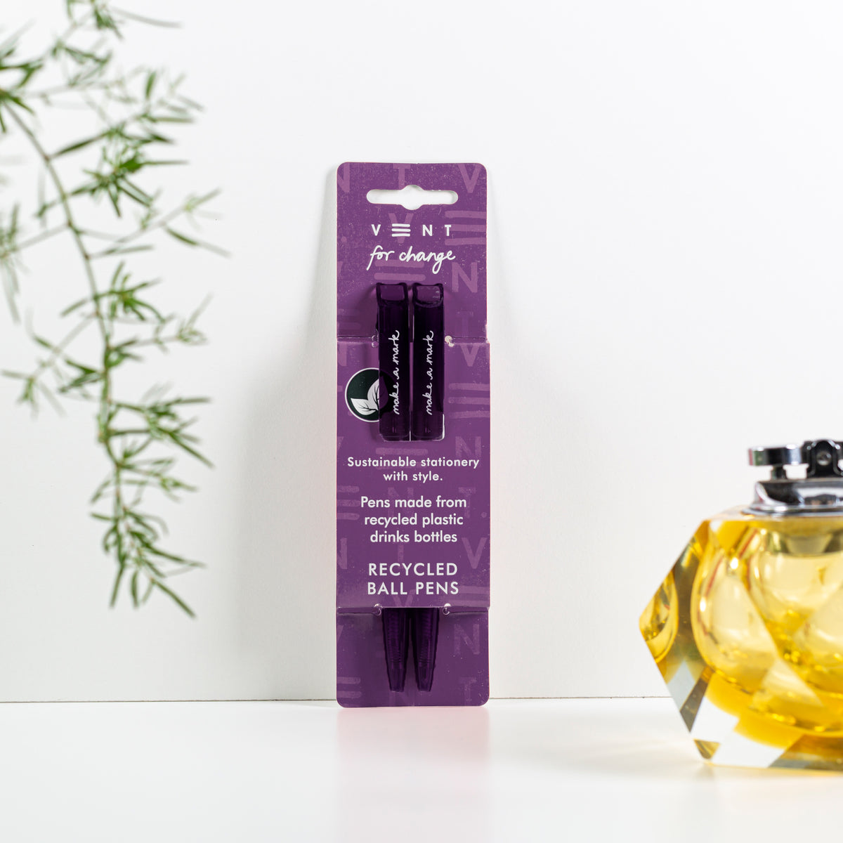 Make a Mark Recycled Pen 2 pack set by Vent for Change in it's packaging against a wall in colourway deep purple